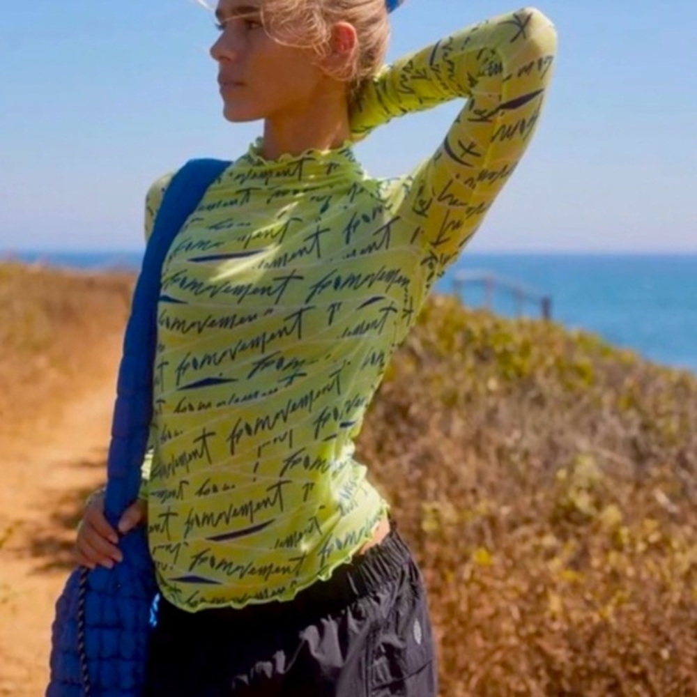 Free people Movement sz M lime green Printed Logo High Jump long Sleeve knit top